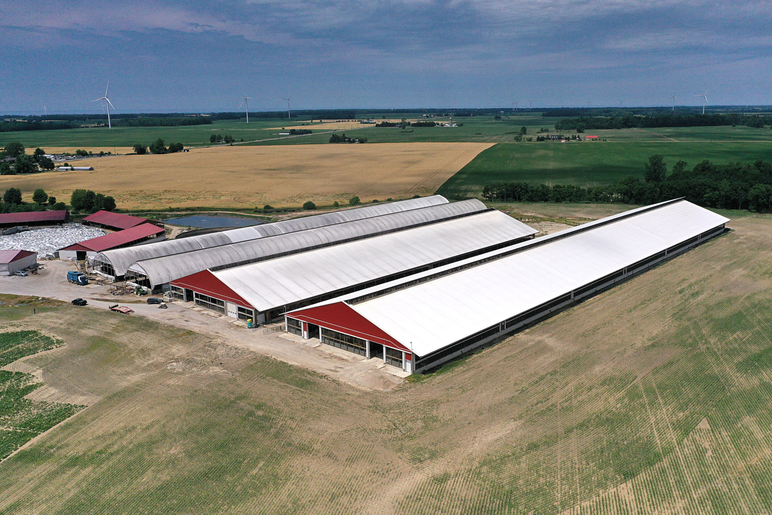 A custom 150’x 754’ fabric roof metal livestock barn in Forest, Ontario.