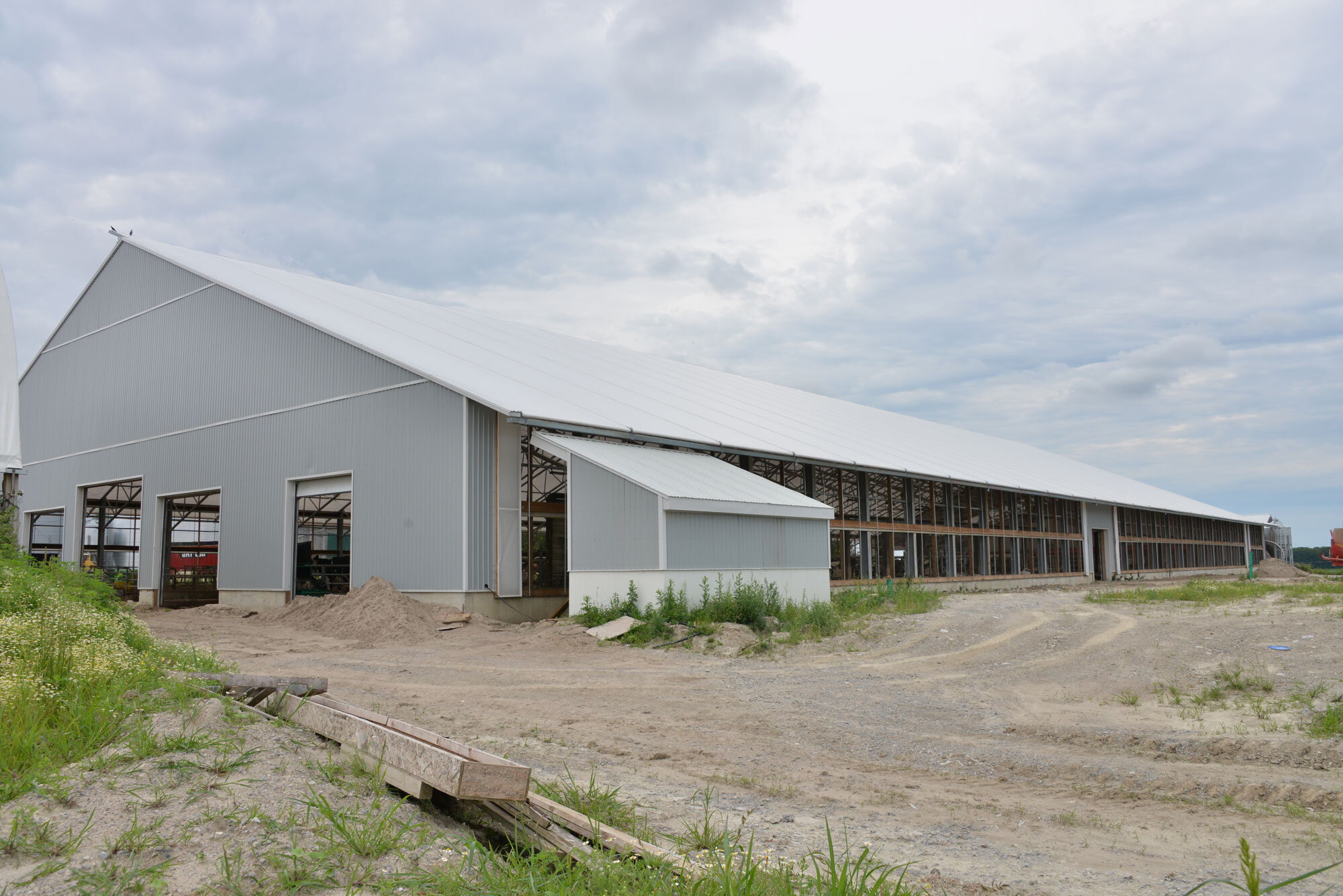 A custom 125’x 300’ fabric roof steel dairy barn in Woodville, Ontario.