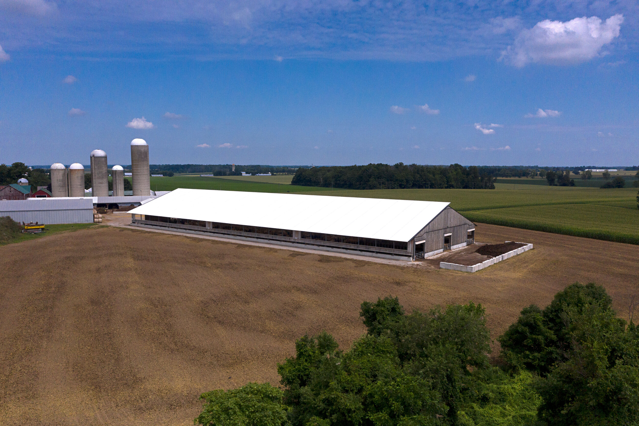 A custom 120’x 354’ fabric roof wood and metal frame beef barn in Ingersol, Ontario.
