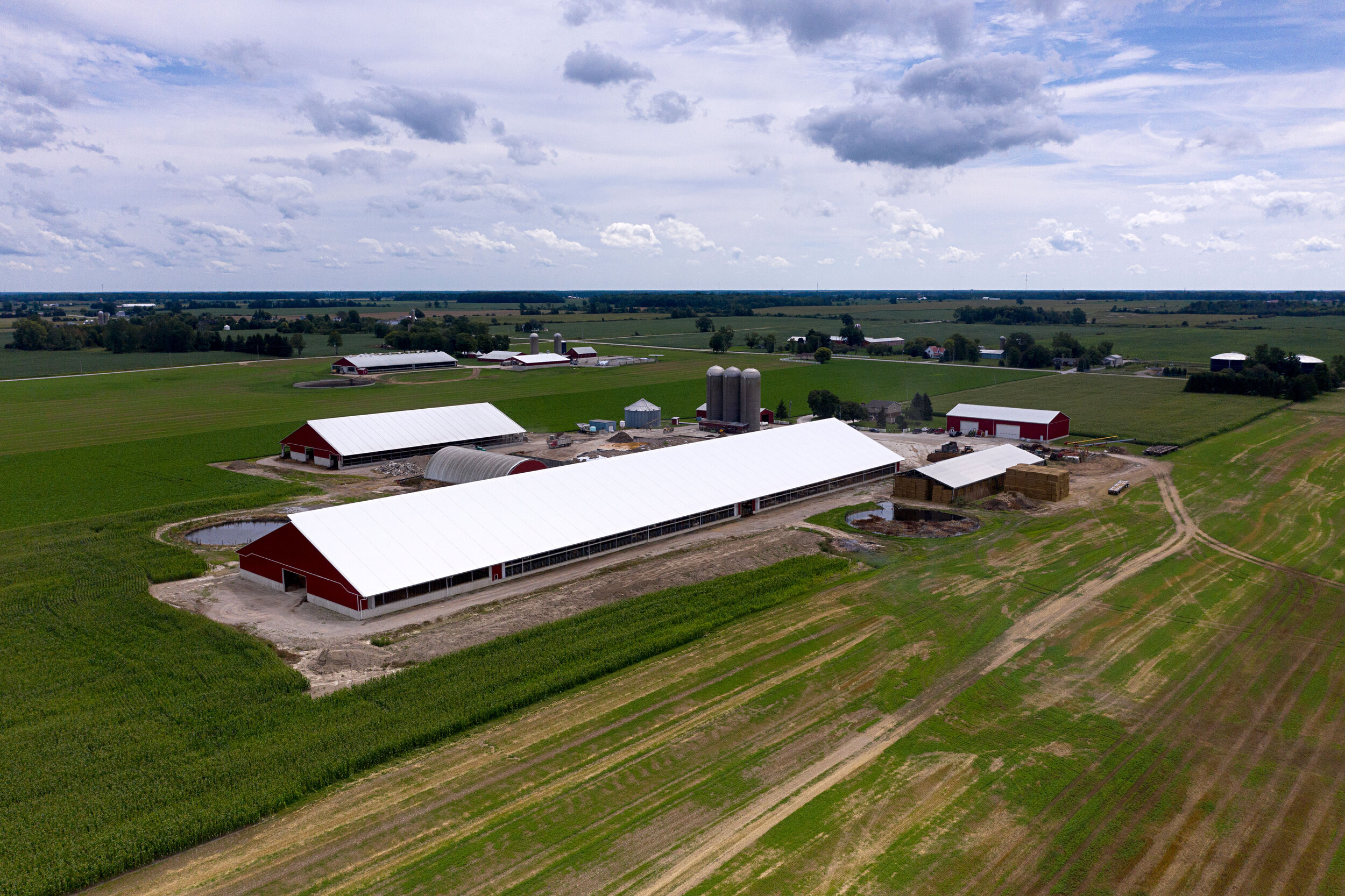  A custom 140’x 610’ fabric roof metal livestock barn in Wyoming, Ontario.