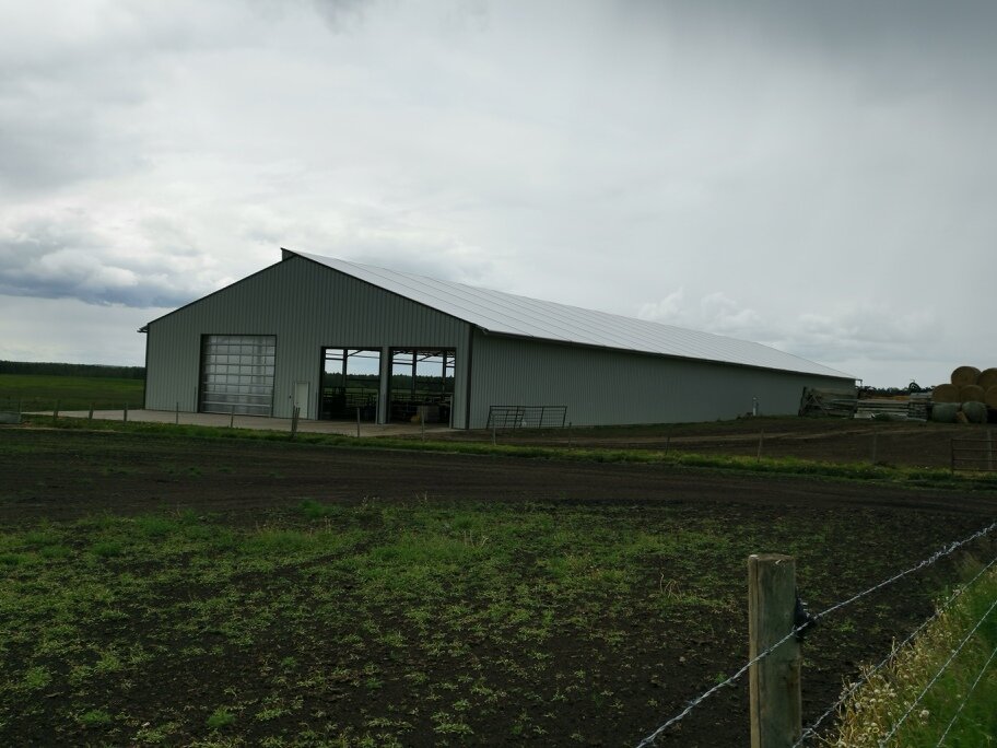 A custom 80’x 354’ fabric roof steel frame dairy barn in Barrhead, Alberta.