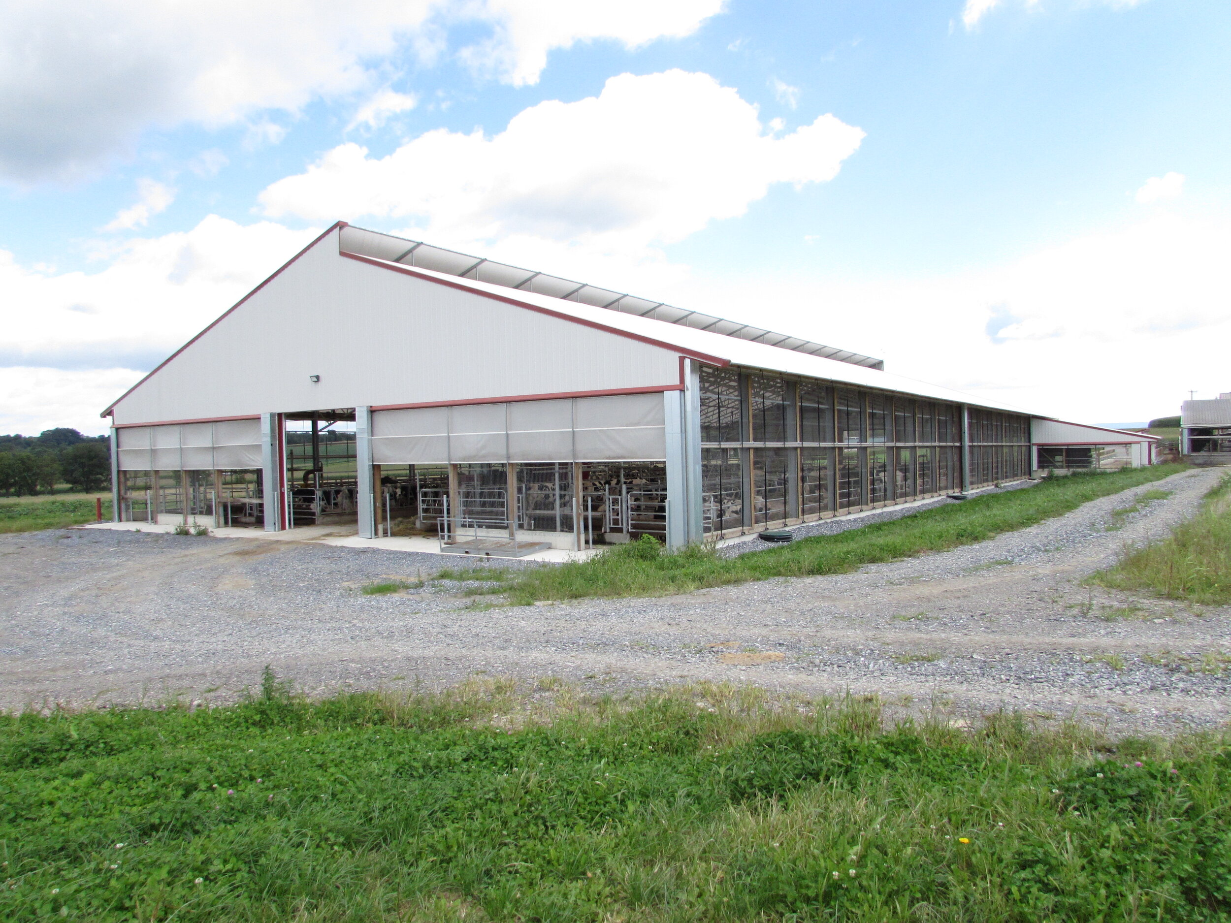 A custom 102’x 204’ fabric roof metal dairy barn in Robesonia, Pennsylvania. 