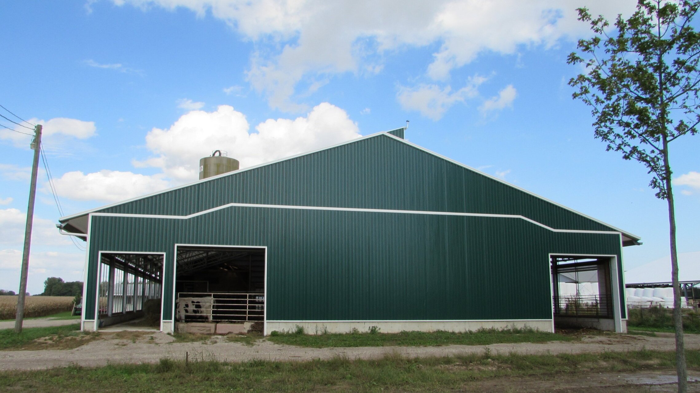 A custom 80’x 130’ fabric roof steel dairy barn in Fingal, Ontario.