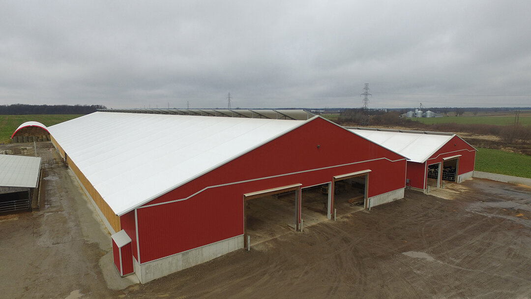 A custom 120' x 400’ fabric roof metal beef barn in Lambeth, Ontario.