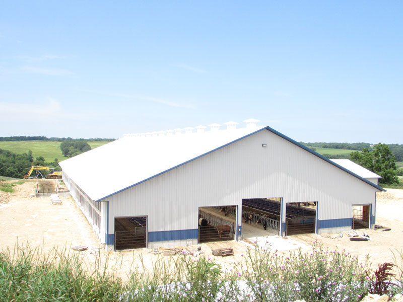 A custom 104’x 242’ fabric roof steel frame dairy barn in Monroe, Wisconsin.