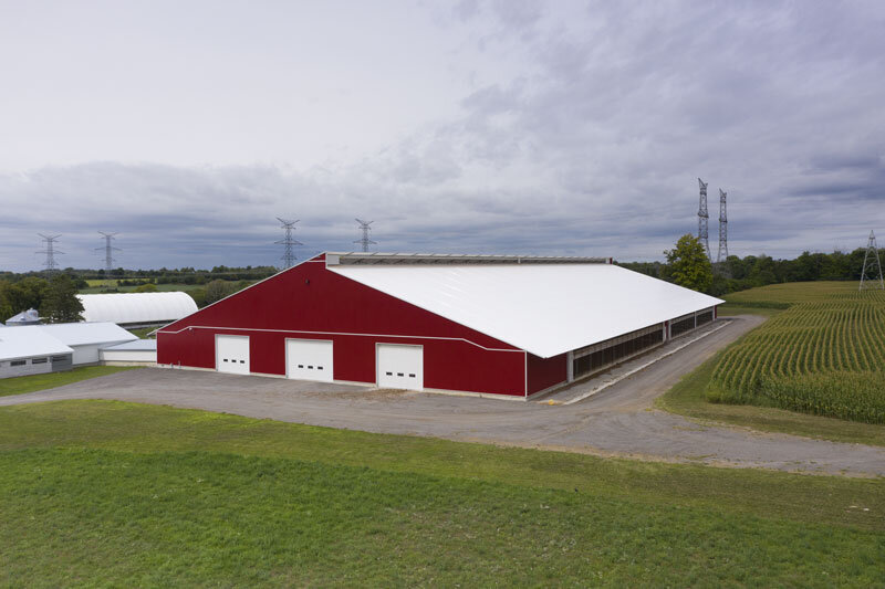 A custom 184’x 370’ fabric roof metal dairy barn in Clarington, Ontario.