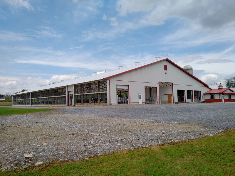 A custom 104’x 290’ fabric roof metal frame dairy barn in Stevens, Pennsylvania.