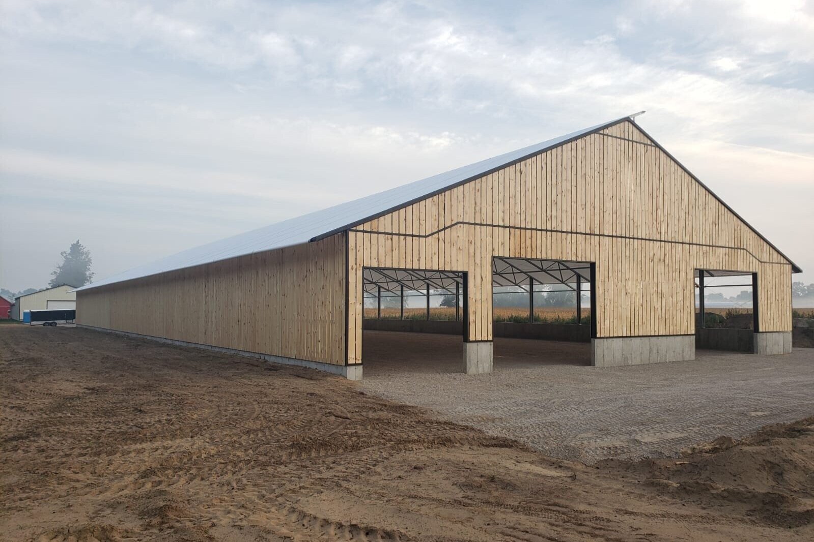 A custom 90’x 242’ fabric roof wood beef barn in Norwich, Ontario.