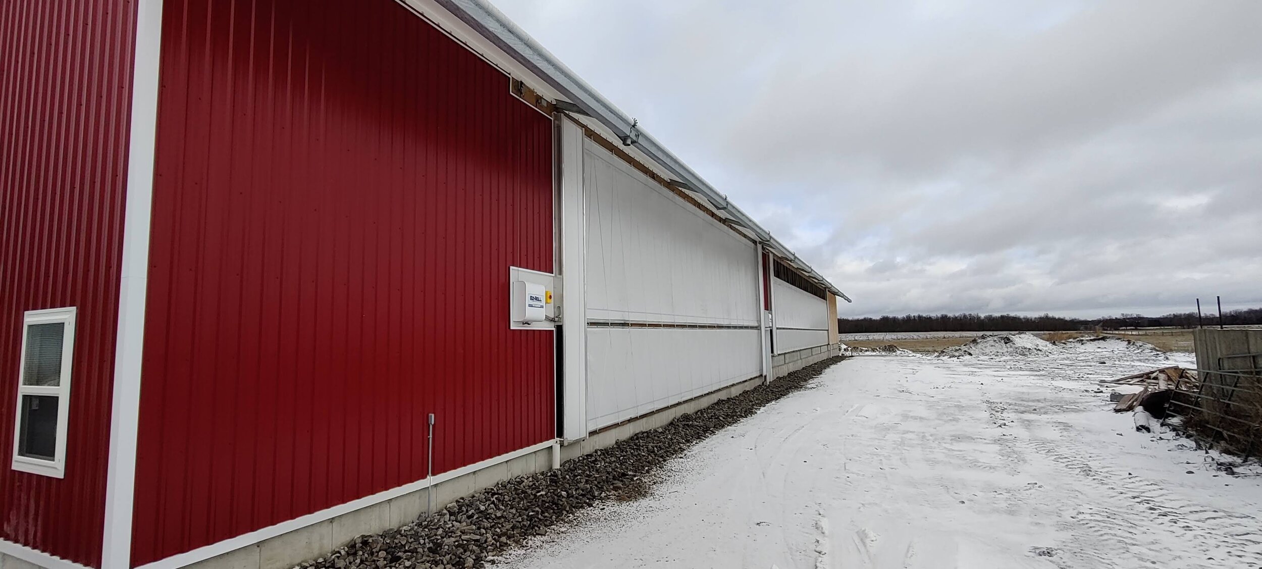 A custom 98’x 178’ fabric roof metal frame dairy barn in Millbank, Ontario.