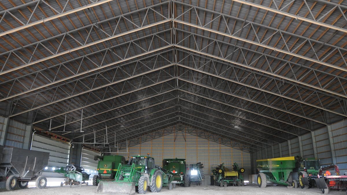  A wooden and steel hybrid steel roof storage building. 