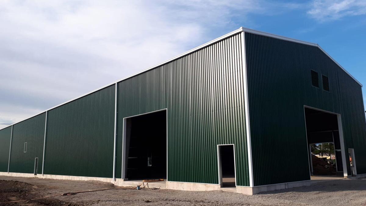  The outside of a steel roof metal barn. 