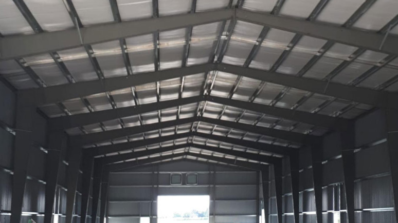  The inside of a steel roof metal barn. 