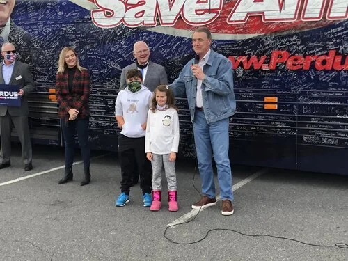 Perdue rallies in Milledgeville with 8 days left