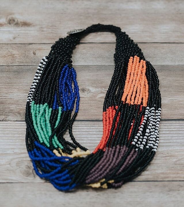 South African Handmade Necklace.  Multi-strand beads of black, red, purple, blue, green and orange.  Measures 20&rdquo;. Button closure is slightly adjustable. $ 175.  This necklace was carefully selected for its unique quality and craftsmanship. 💯%