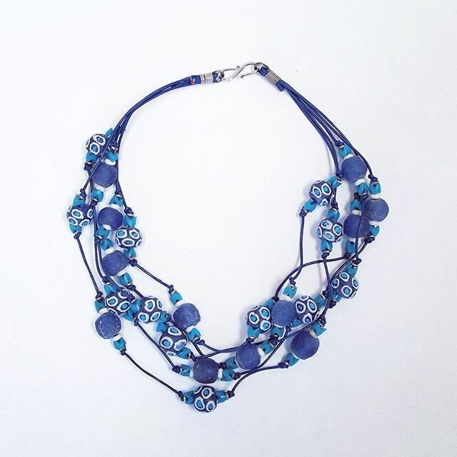 Blue Glass Beaded Necklace. $175.  Handmade by women in Kenya.  20&rdquo; leather cord. 💯% profit funds skills building projects for women, conservation and education.  We also can mail internationally.  #kenya #empoweringwomen #endangeredspecies #c