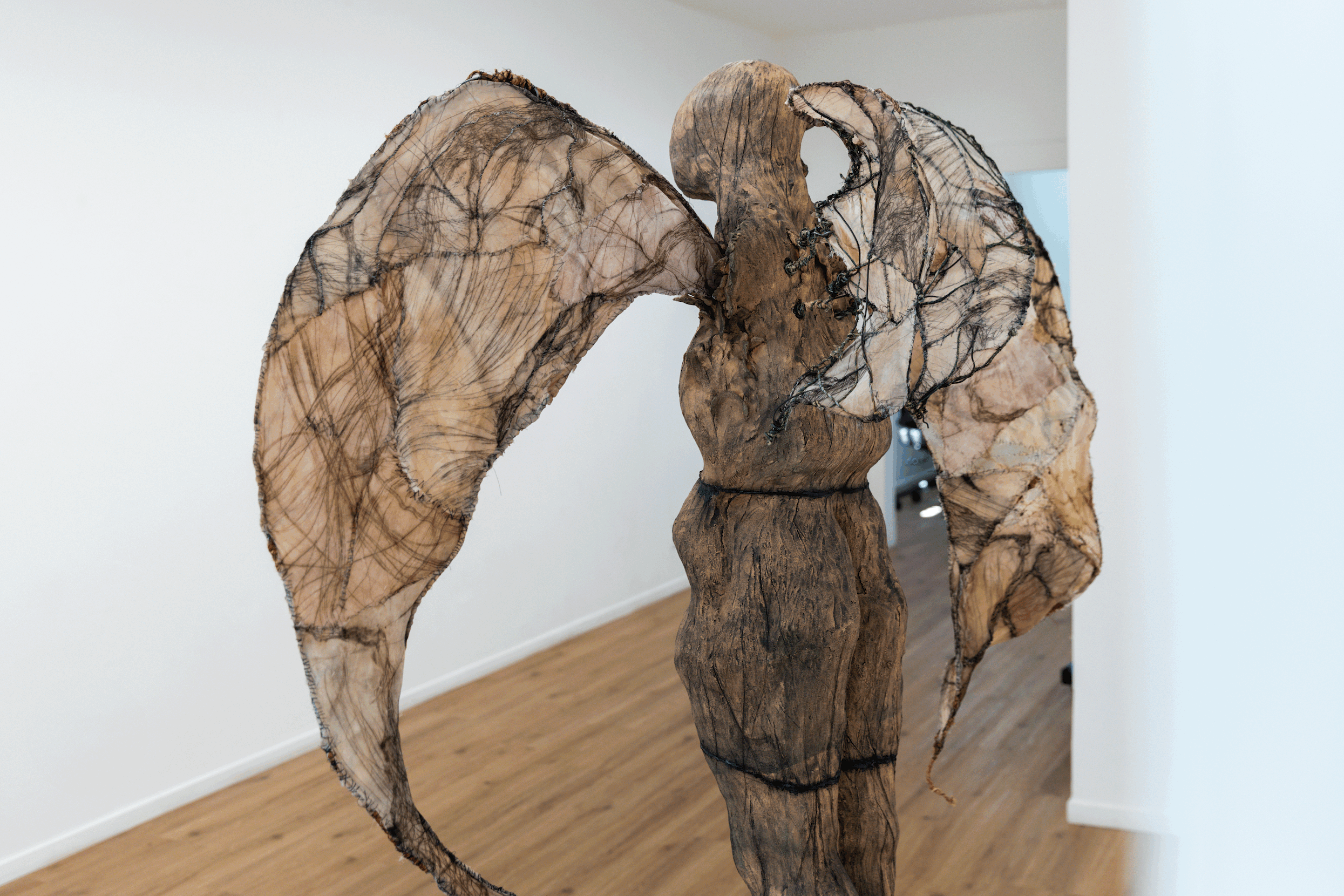 “Winged Figure”, Christina Y. Fesmire, Nguyen Ly, Ceramic, Drypoint on Fabric, Tea, Coffee, Hand-Stitching, Blood, Wire, Dimensions Variable, 2025