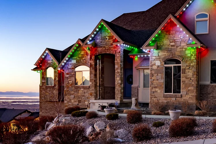 Colorful permanent roofline lighting on a Northern Utah home