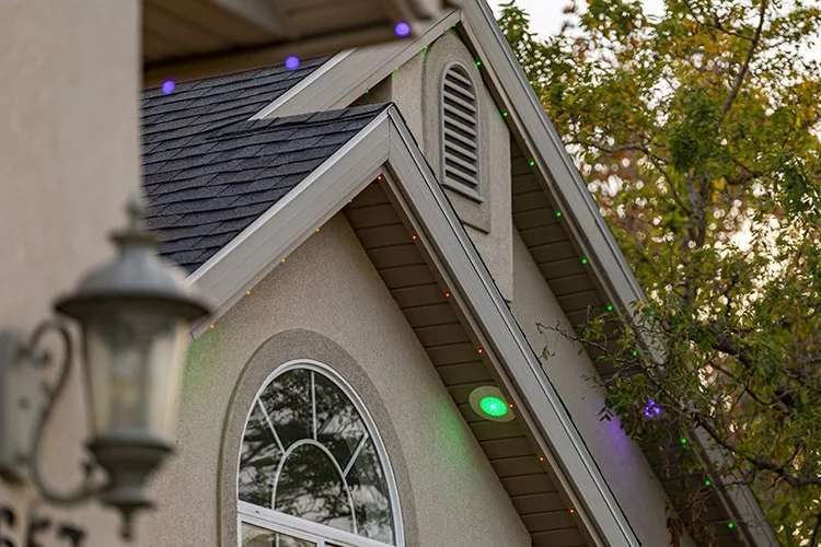 Permanent accent lighting on a residential roofline