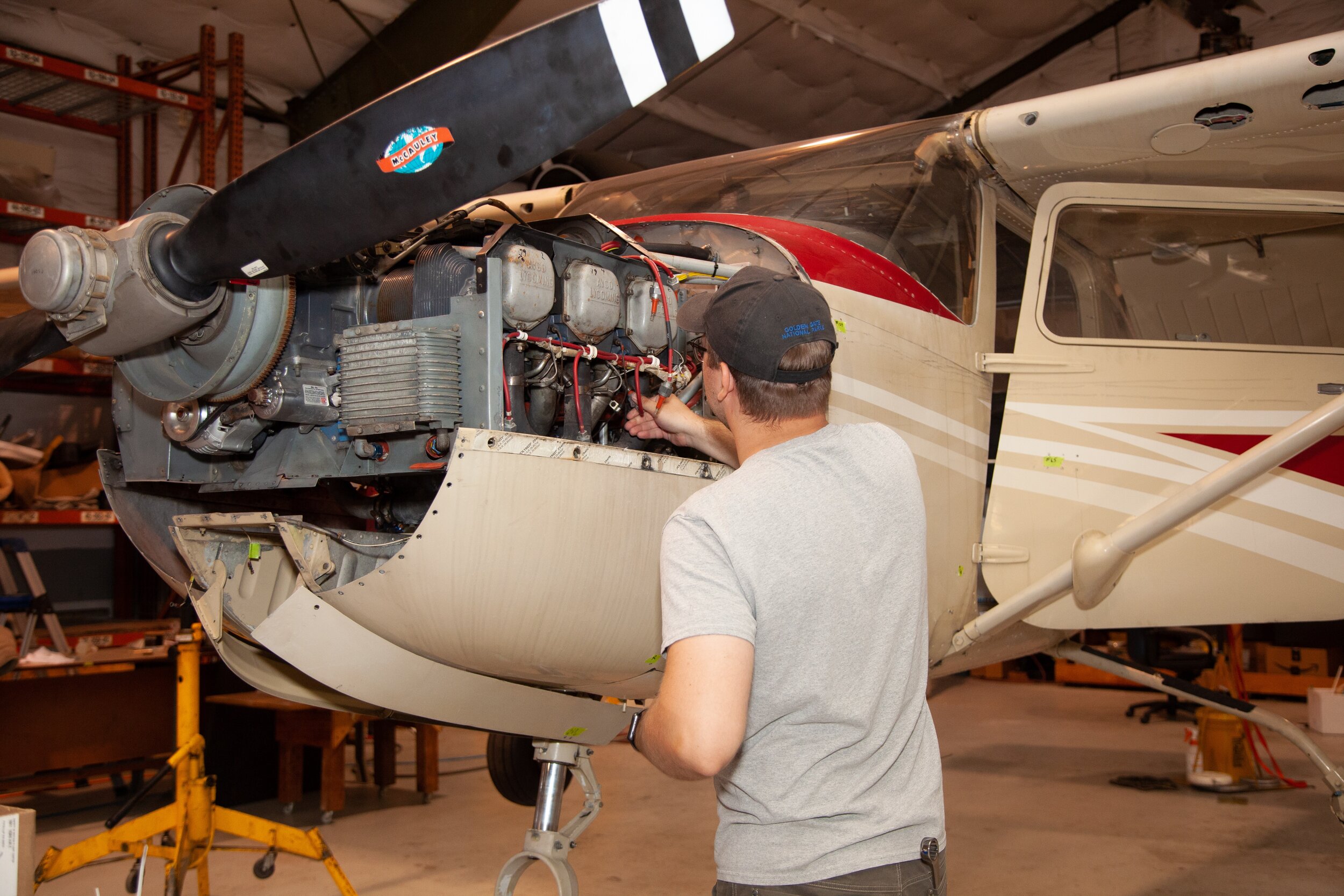 Safety in Motion Maintenance Services image of man repairing plane engine.jpg