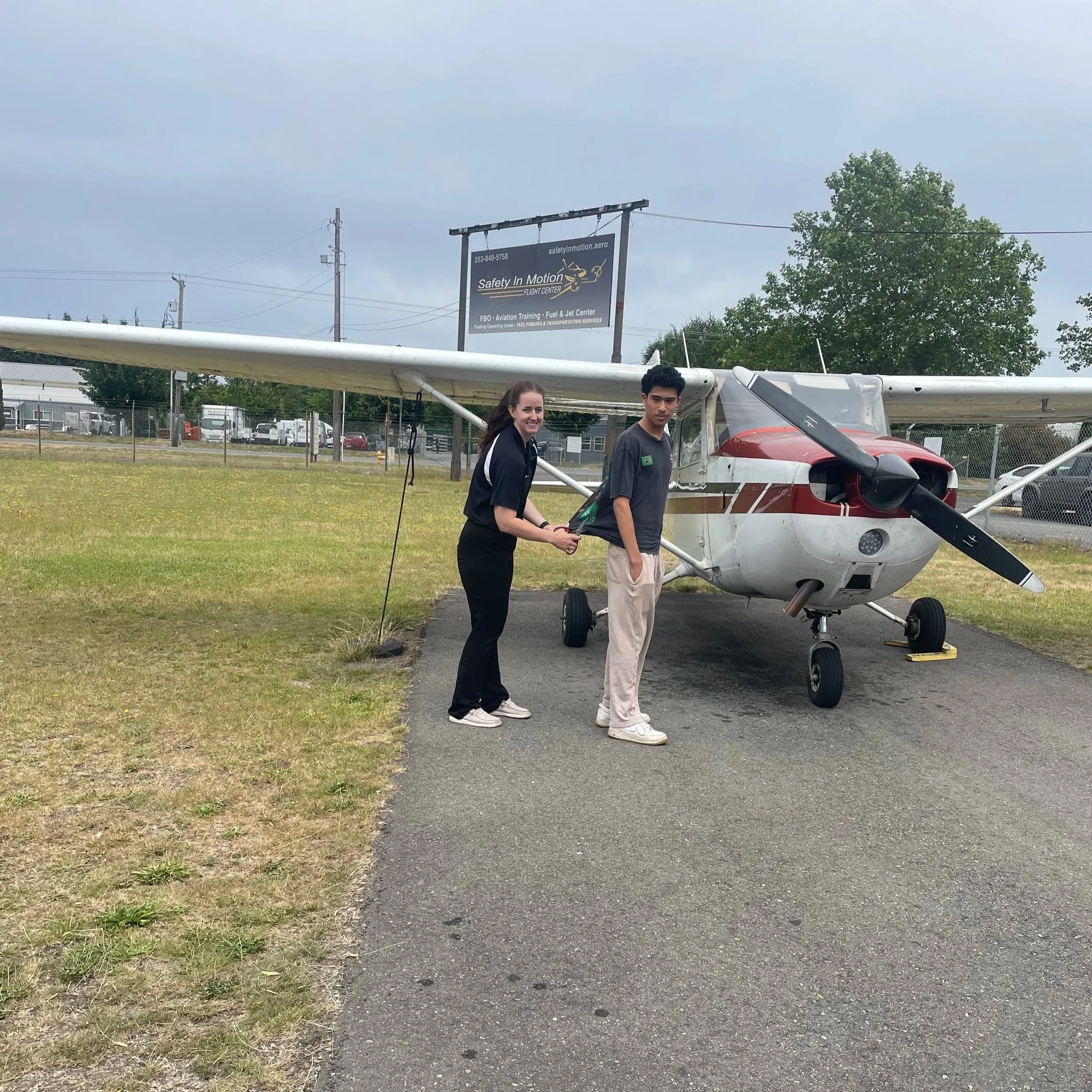 The traditional cutting of the shirt for Shion Alvarado's first SOLO flight by his CFI, Camryn Beidler.  Congratulations Shion!! 