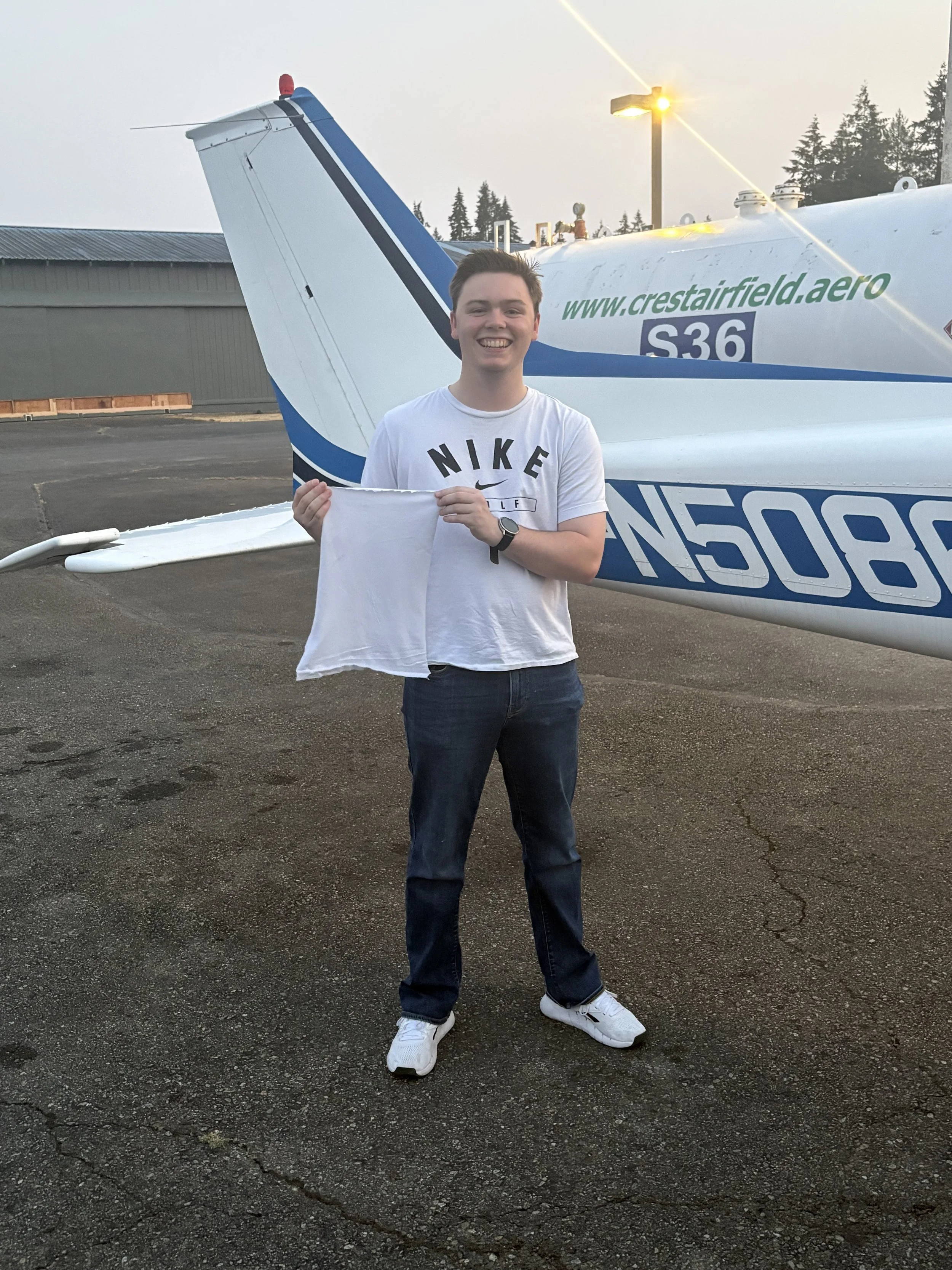 Traditional shirt cutting for Jackson Carlson's first solo on 8-14-26, with CFI, Jenelle Cross. Congratulations!