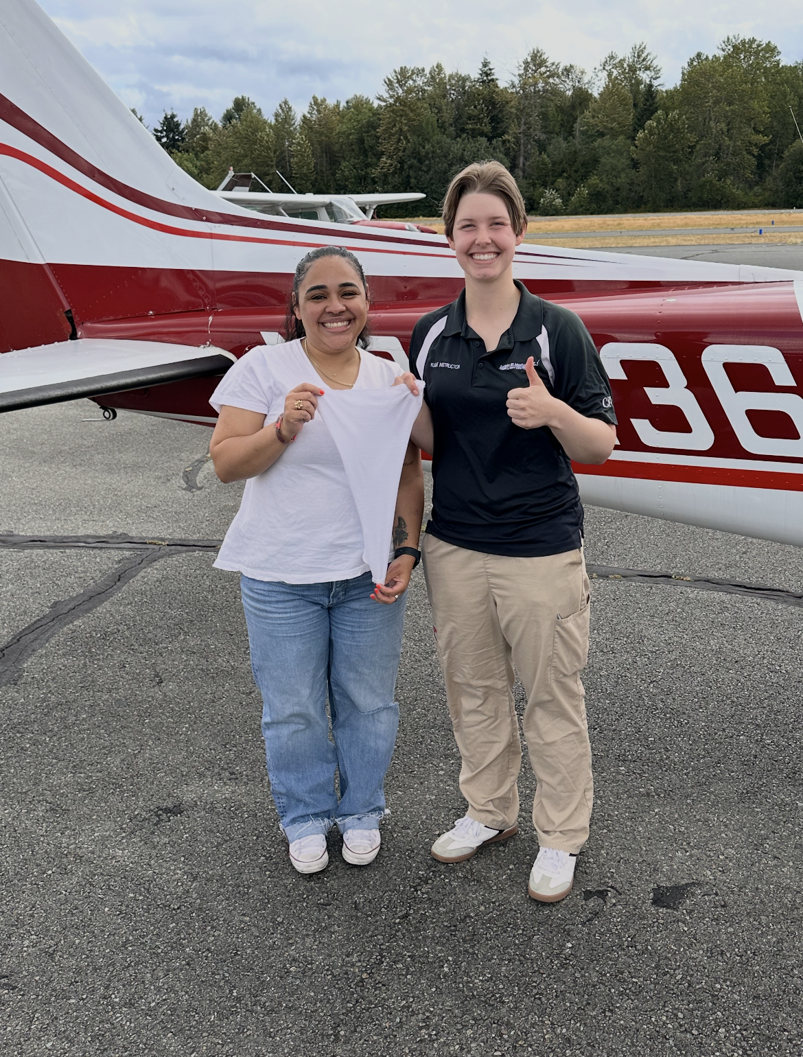 Traditional shirt cutting for Ashlee Tillett's first solo on 7/25/26, with instructor Kylie Eastman. Congratulations Ashlee!