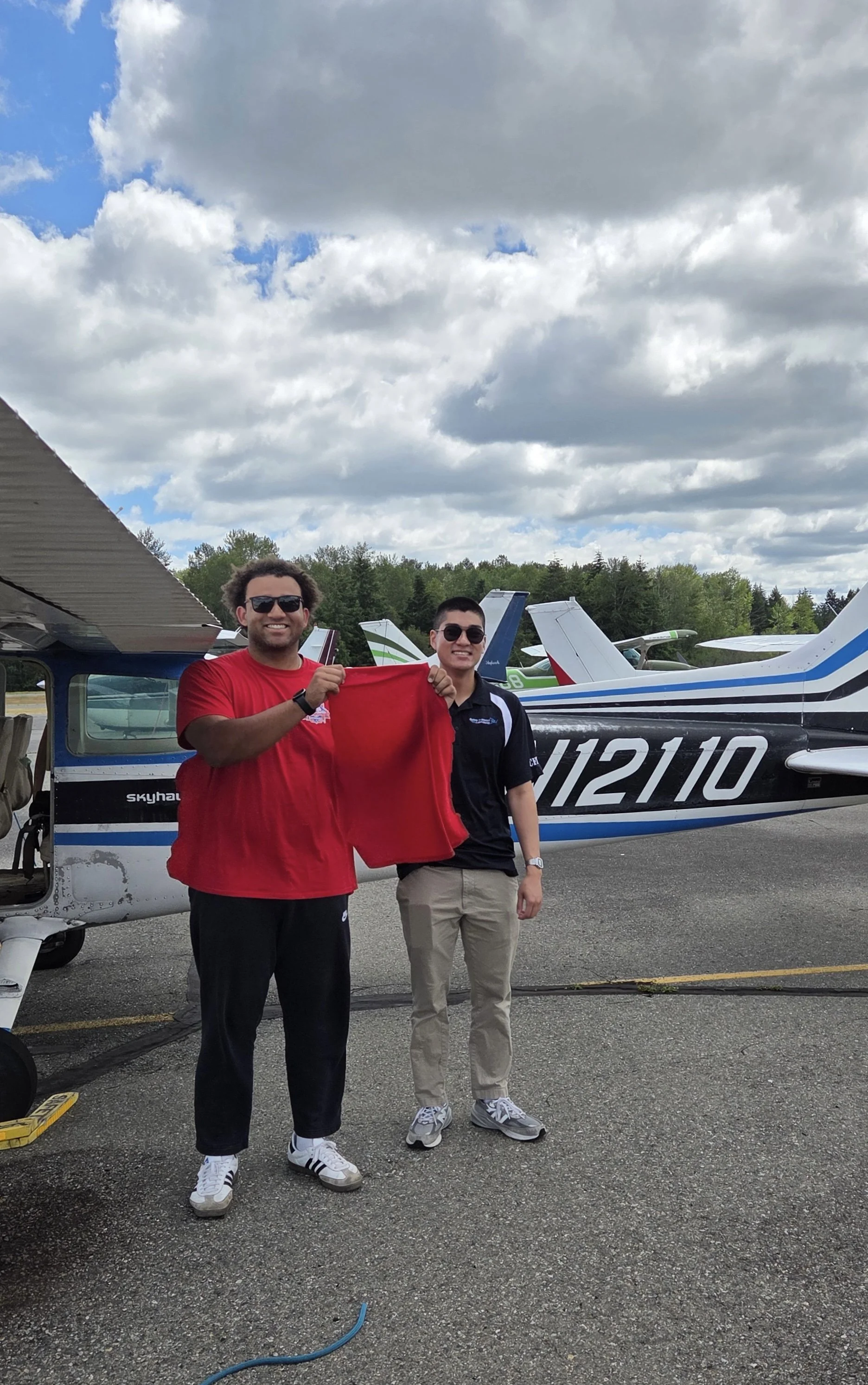 The traditional cutting of the shirt for Kenyan's first SOLO flight by his CFI, Jeremy Dao.  Congratulations Kenyan!! 