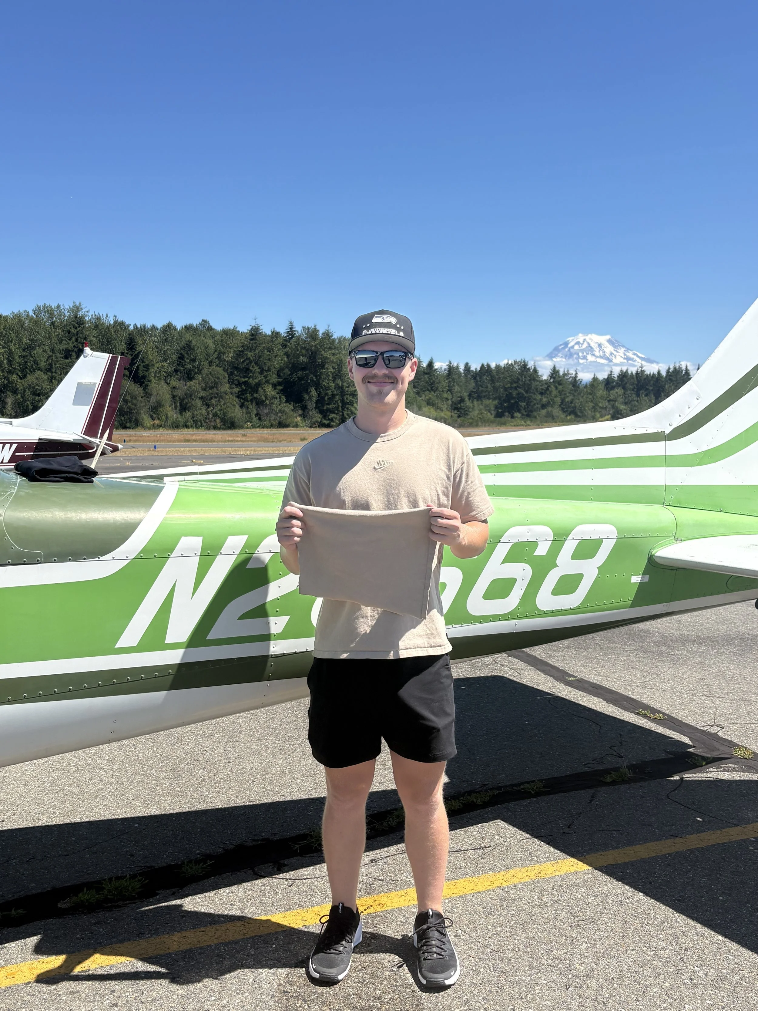 Traditional shirt cutting for Ian Loebbecke's first solo, with CFI, Jenelle Cross. What a perfect day for a solo flight!