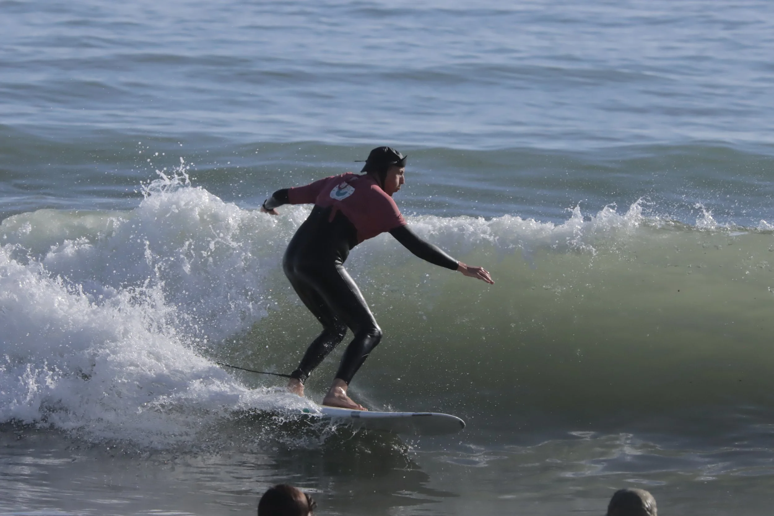 An Intermediate surfer during a sunset surf at Banana Point, Aourir, Morocco.