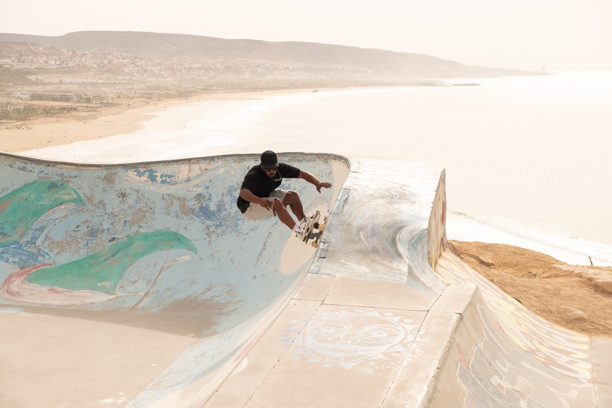 Ayoub, Local Surf Maroc surfskate instructor, skateboarding at Taghazout skatepark.