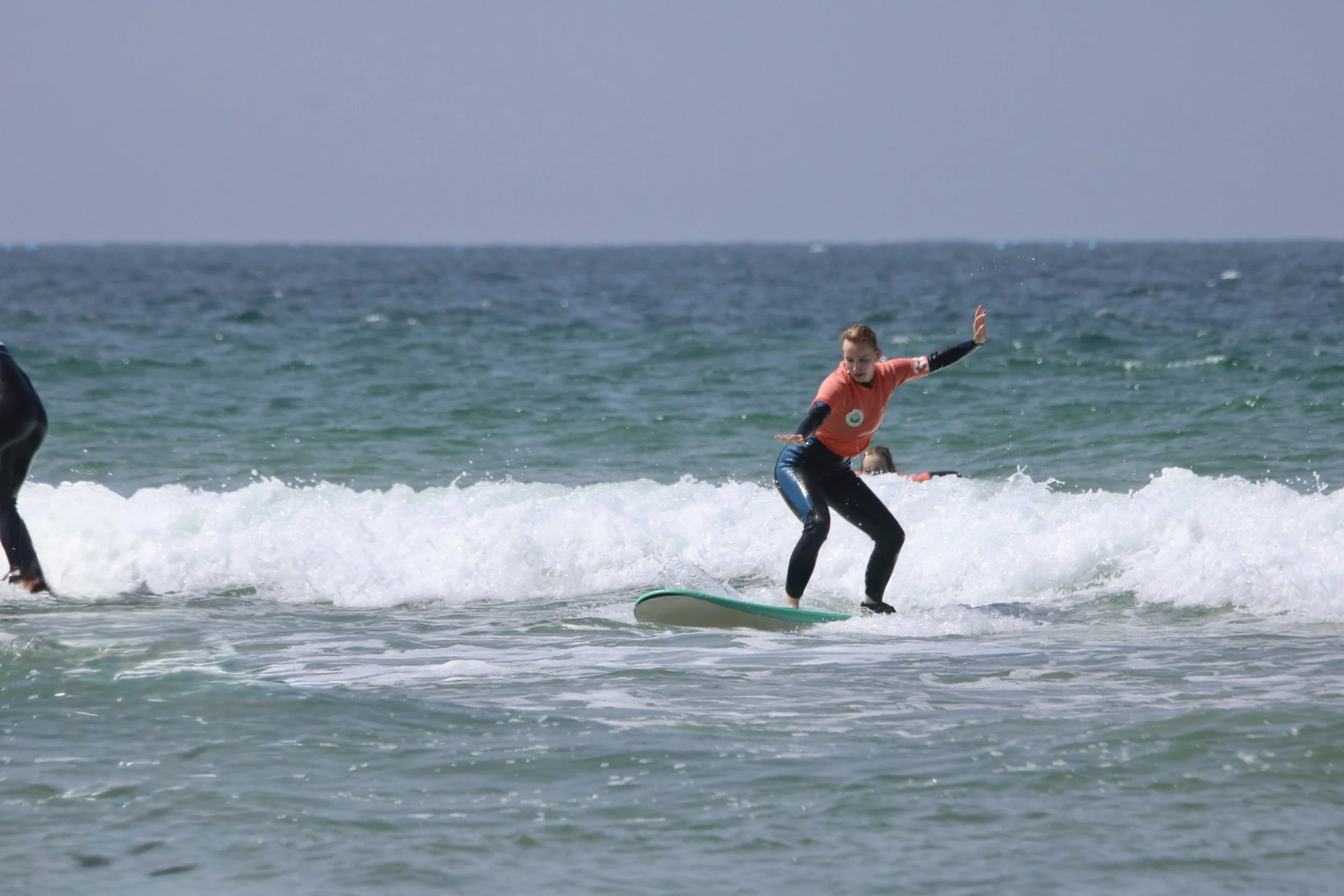 Beginner surfer catching their first whitewash, Tamraght, Morocco