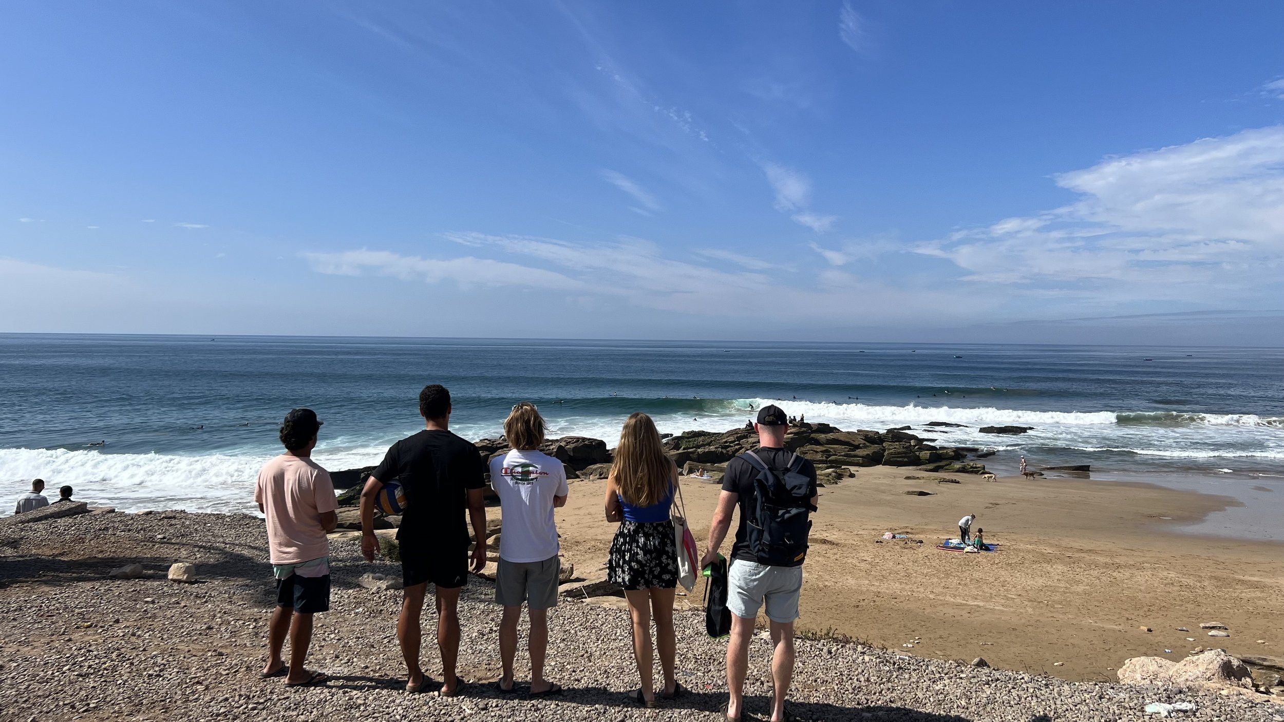 Intermediate surfers with Local Surf Maroc checking Anchor Point, Taghazout for surf level suitability.