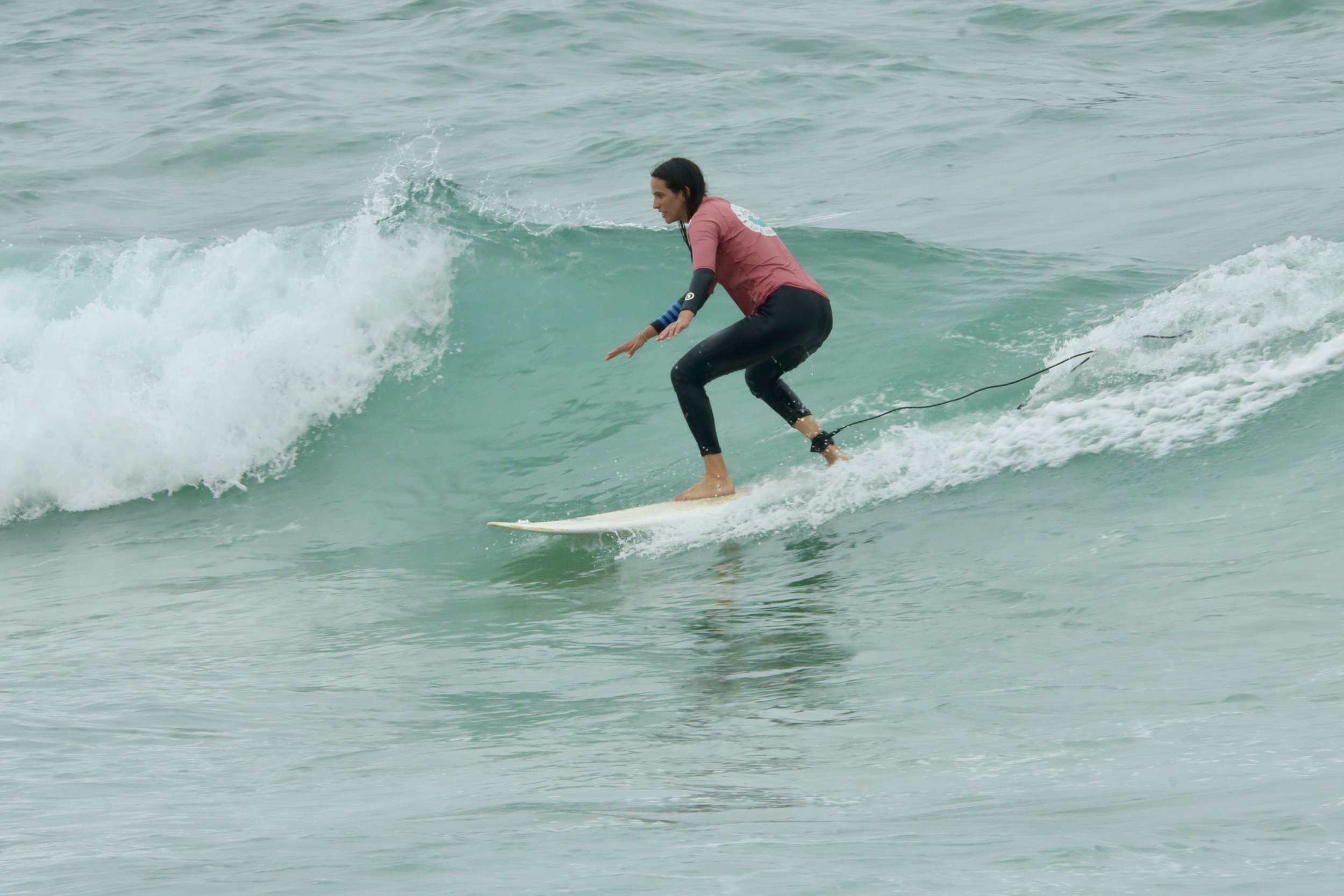 An Improver surfer starting to learn wave direction, Taghazout, Morocco.