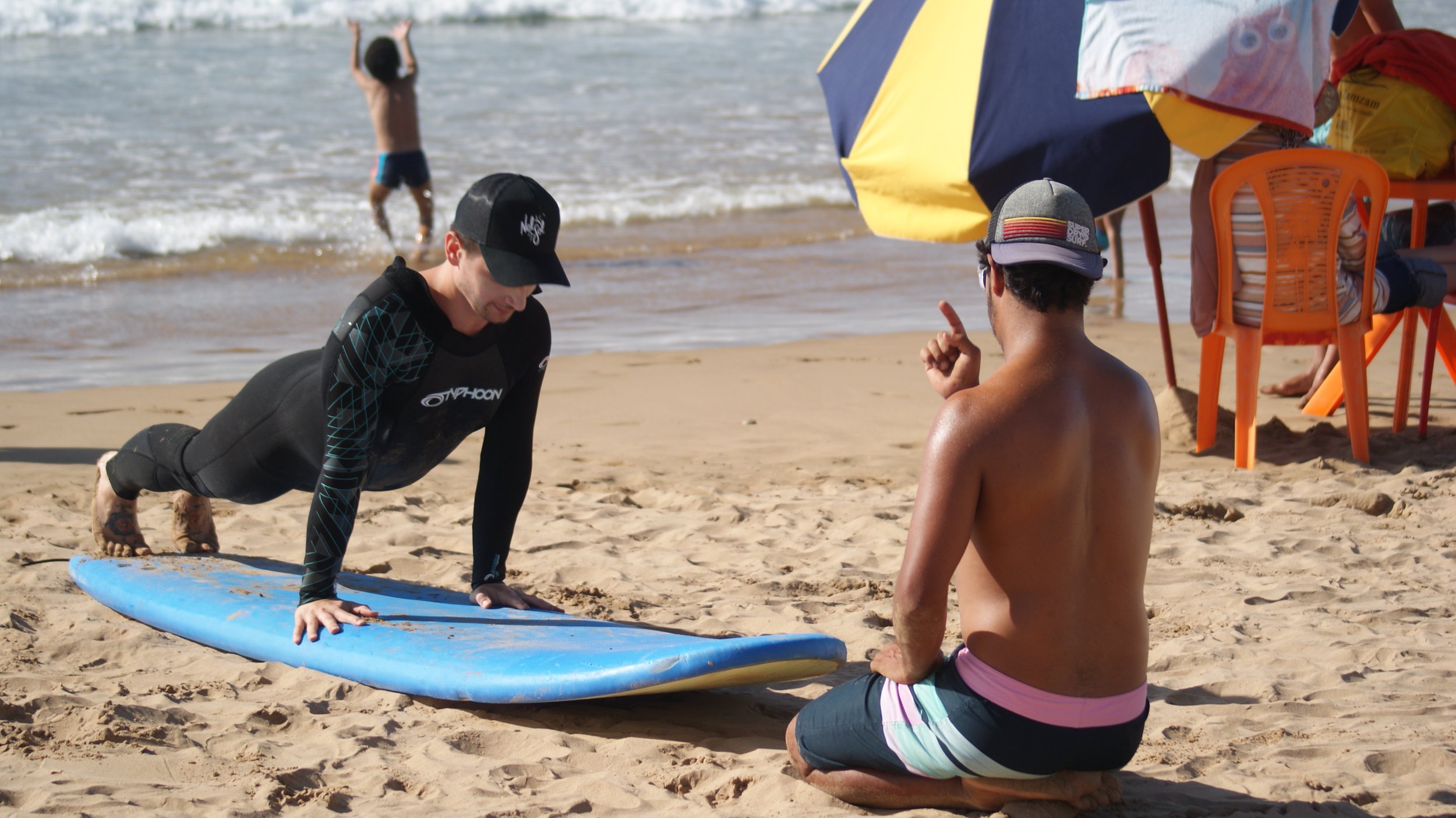 Rachid, ISA Surf Coach, teaching private beginner surf lesson on Crocros, Tamraght, Taghazout Bay, Morocco.