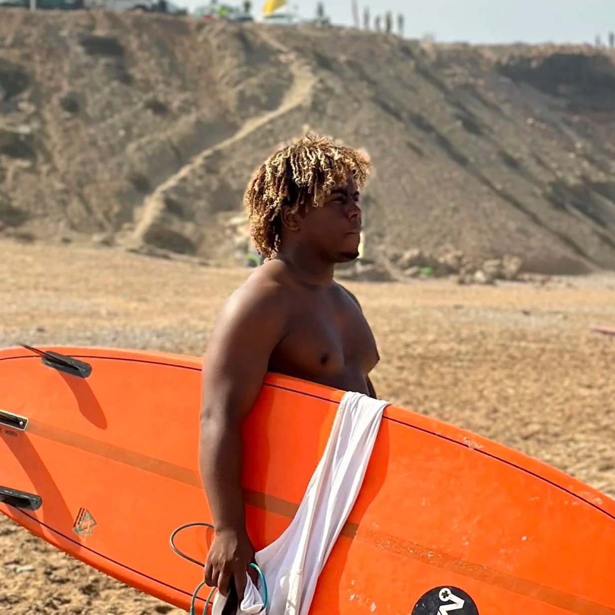 Othmane, Local Surf Maroc surf coach and surfskate instructor on the beach and ready to teach in Morocco.