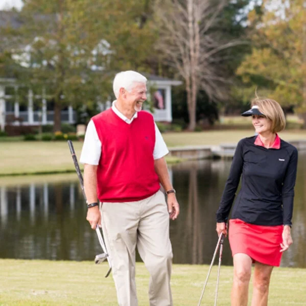 River Landing Couple Playing Golf
