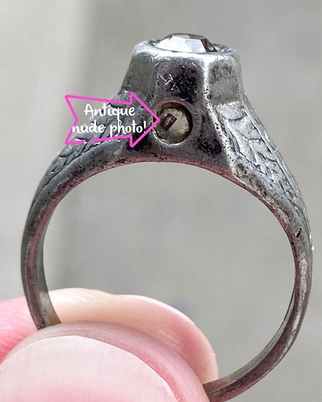 An antique nudie picture smaller than a grain of rice...put inside a ring?? Yup!

Called a Stanhope lens, this teeny, tiny lens, used in jewelry or small toys, was implemented during the early 20th century for tourist souvenirs, religious memorabilia