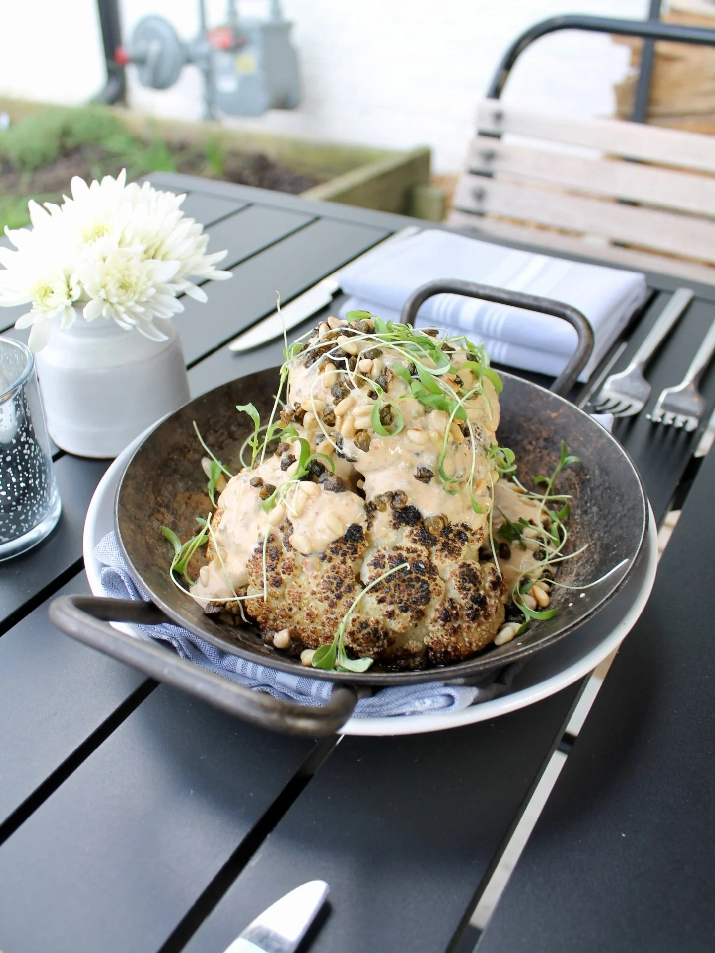 Something new to start the table while deciding on dinner:

Wood-fired Cauliflower with capers, pine nuts, and Calabrese yogurt, with micro cilantro garnish (gf)