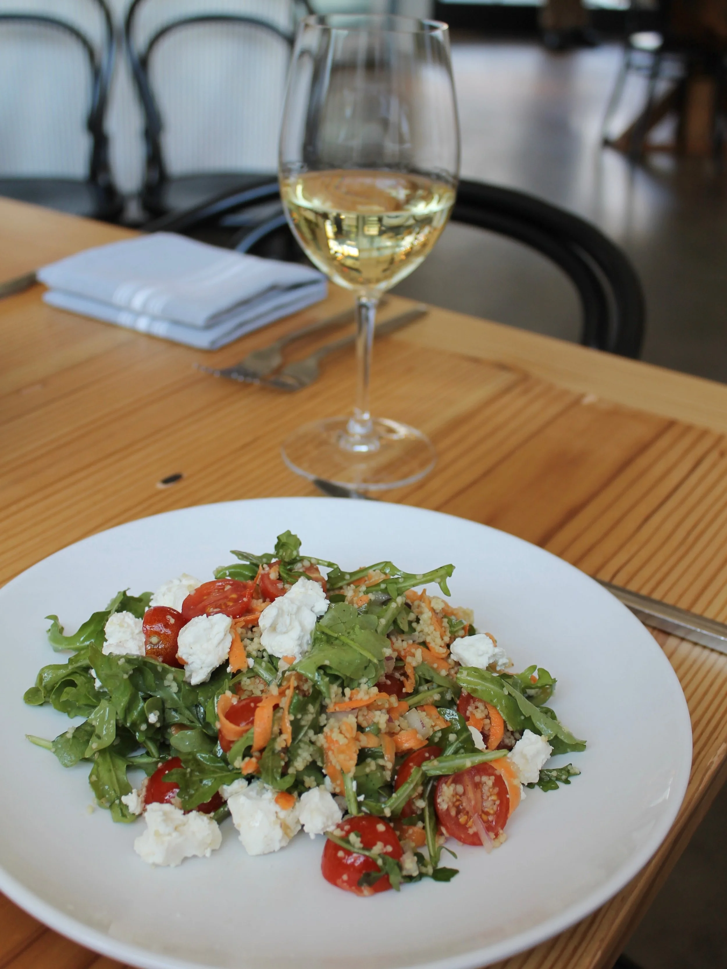 Dining with us this evening? We suggest starting with our Arugula Couscous Salad and a glass of @tiefenbrunnerwinery Pinot Grigio 

📸 Arugula Couscous Salad &bull; arugula, couscous, sweet potato, cherry tomato, red onion, Valbreso feta, and basil-l