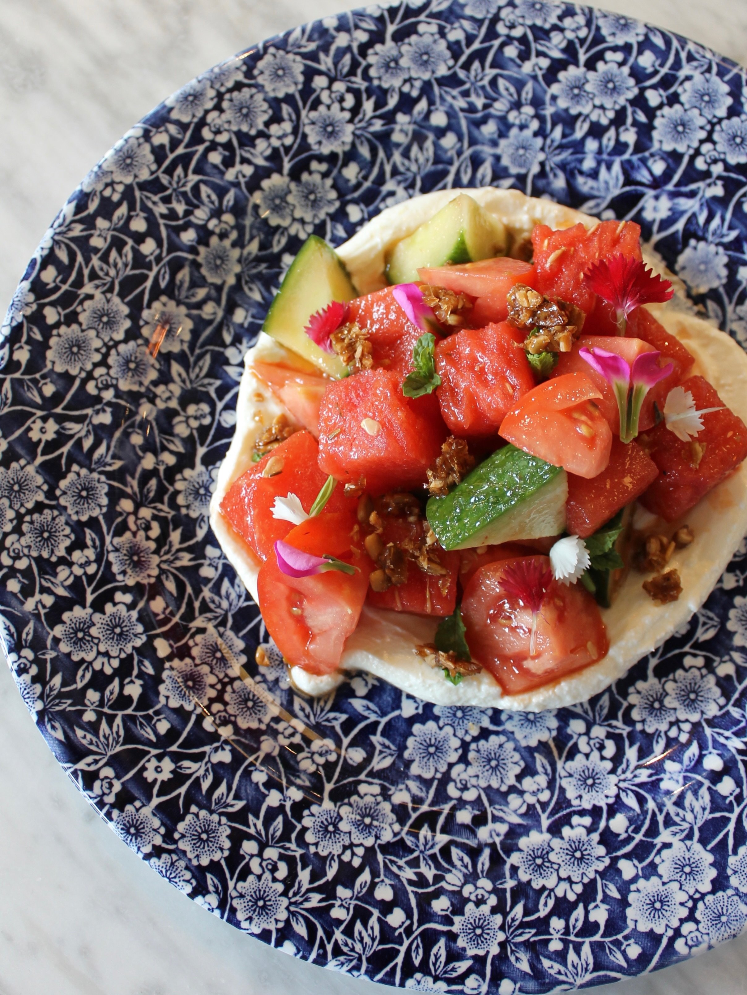 Adding a pop of color to our seasonal offerings, the Watermelon Horiatiki is light, refreshing, and delicious. 🍉

Available lunch and dinner. 

Watermelon Horiatiki ⬩Roma tomato, English cucumber, whipped feta, candied sunflower seed, and mint (gf/v