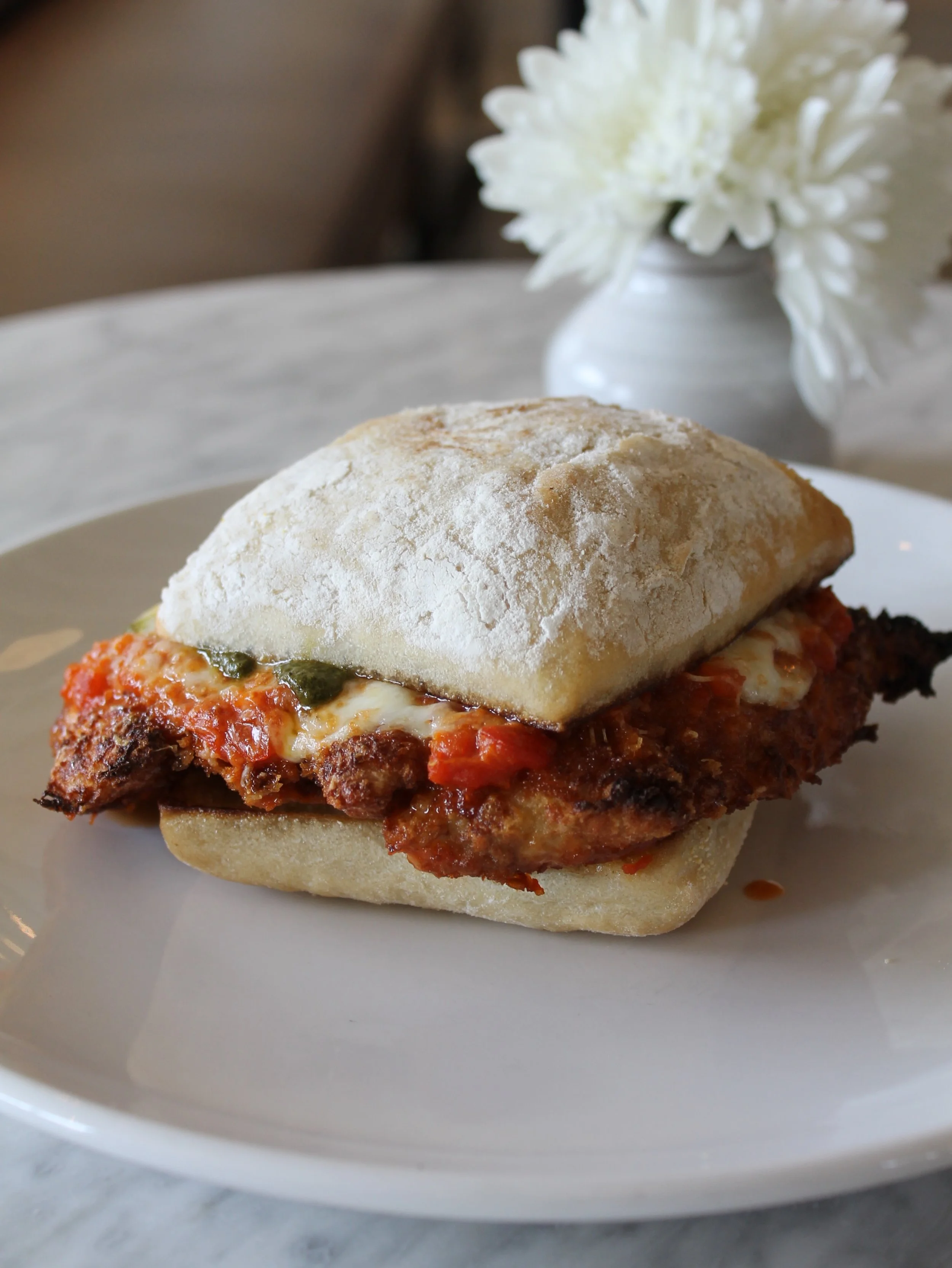 Lunch break: where our love language meets your midday escape.

Chicken Parm ⬩panko fried chicken cutlet, pomodoro alla vodka, buffalo mozzarella, and basil pesto

Lunch served Tuesday through Saturday, 11-2.