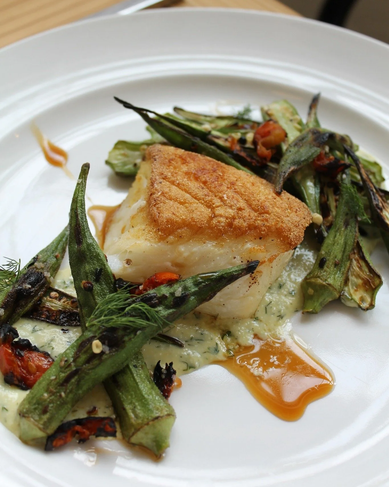 Our new Chilean Seabass checks all the culinary excellence boxes.

Taste for yourself why this dish is quickly becoming a guest favorite.

🍽️ Pan-roasted Chilean Seabass | wood-fired okra | blistered cherry tomatoes | dill gribiche | roasted Meyer l
