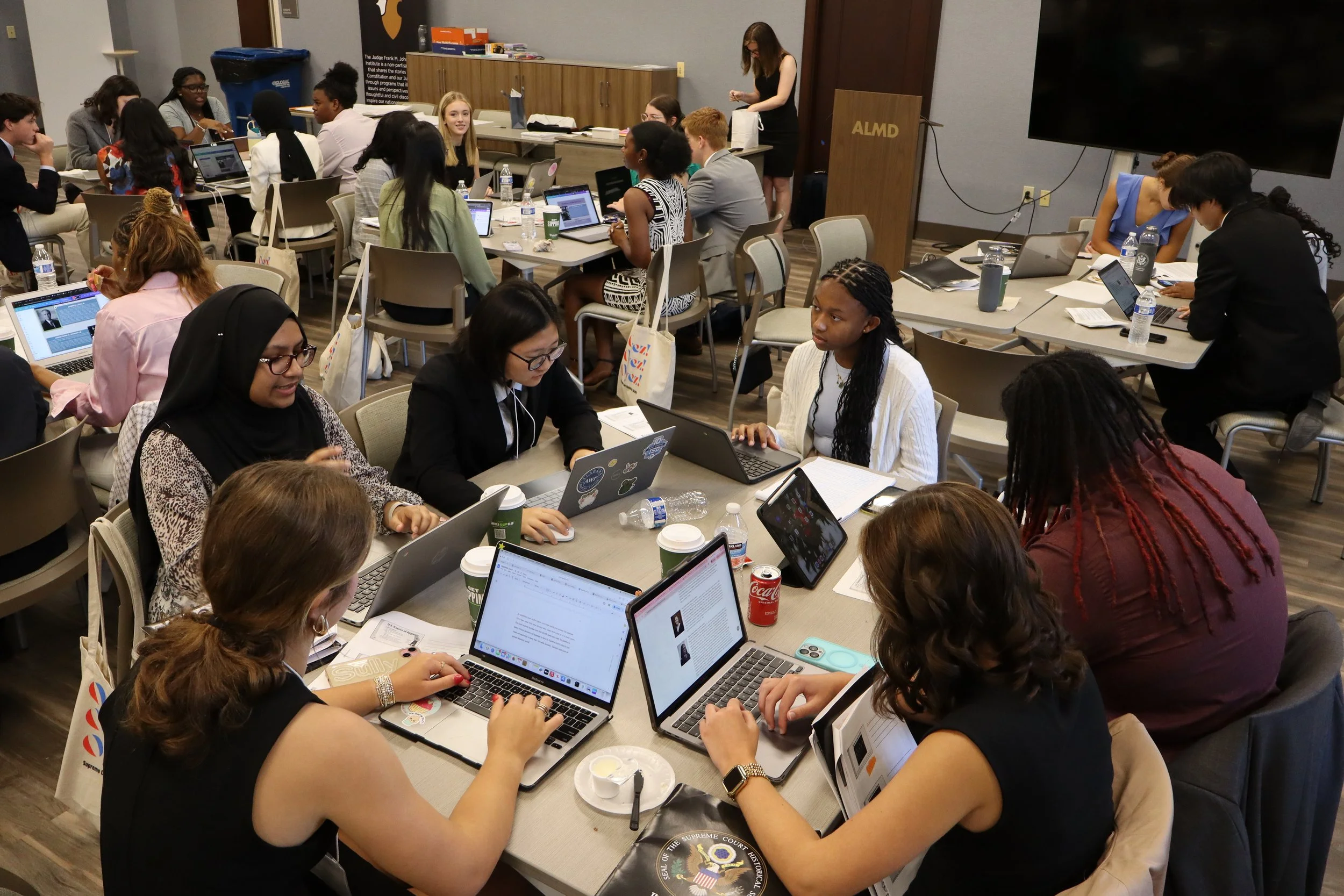  Students participating in the Supreme Court and my Hometown work on their final projects about Frontiero v. Richardson. 