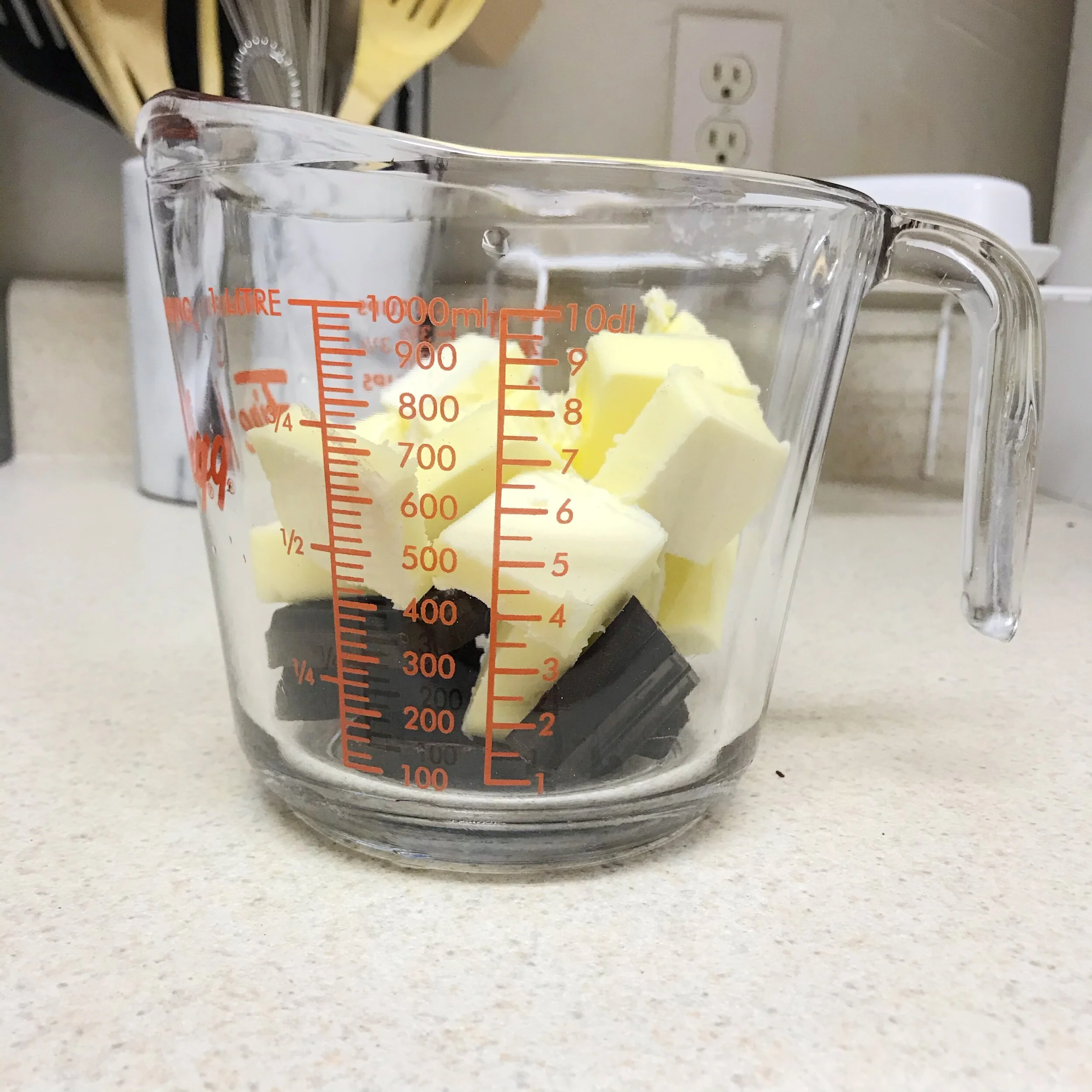 I say “one and a half bowl brownies” because my mixing bowl is not heat safe, so I’m not going to melt the butter and unsweetened chocolate in it. Instead,. I use my Pyrex measuring cup — you can use any heat-safe bowl.