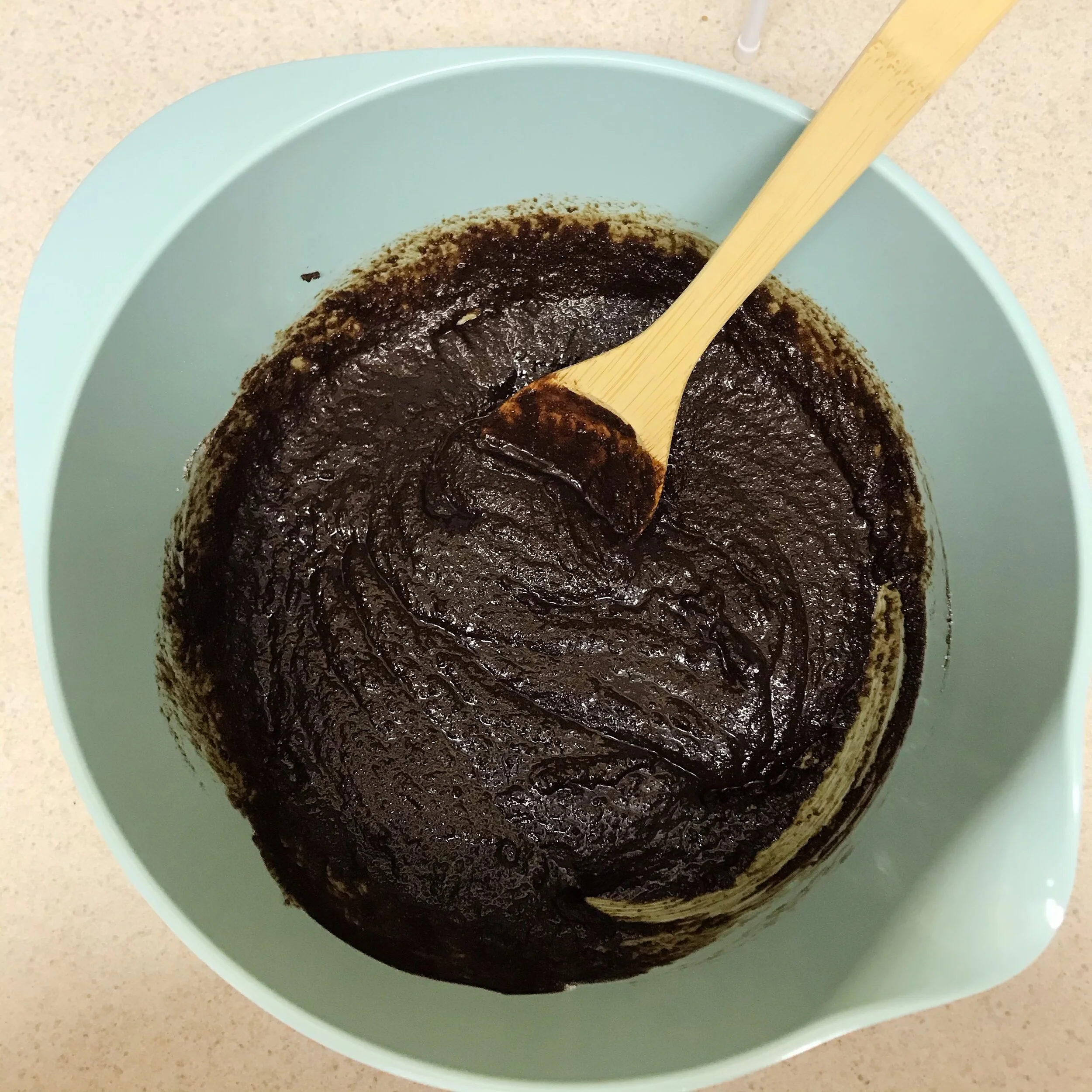 After sugar is mixed into the butter and chocolate mixture