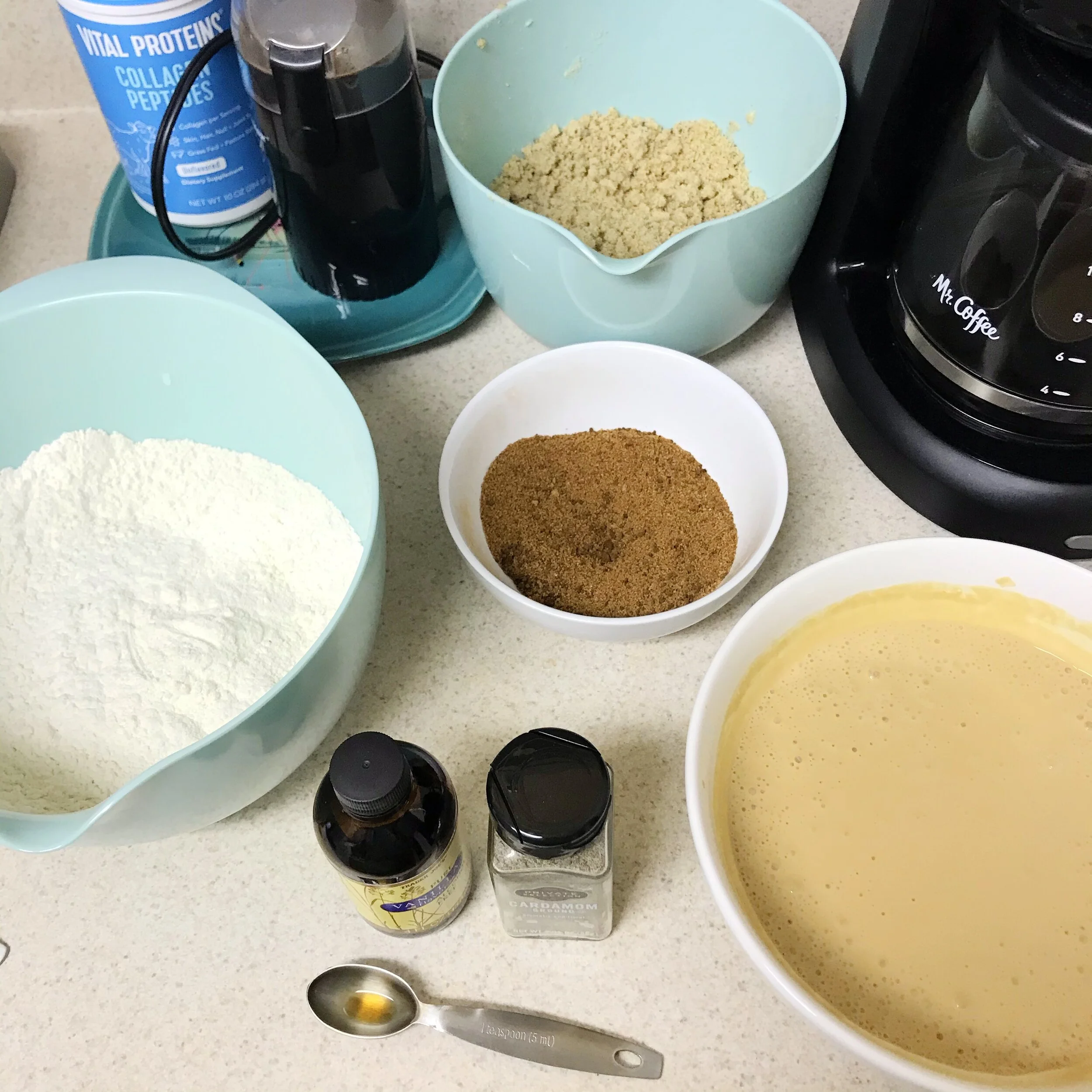 All the components, starting at the 12 o’clock position and going clockwise: the crumble top, the coffee ribbon for the middle of the cake, the sour cream and coffee mixture, the dry ingredients. And that coffee pot has my cooled, morning coffee in …