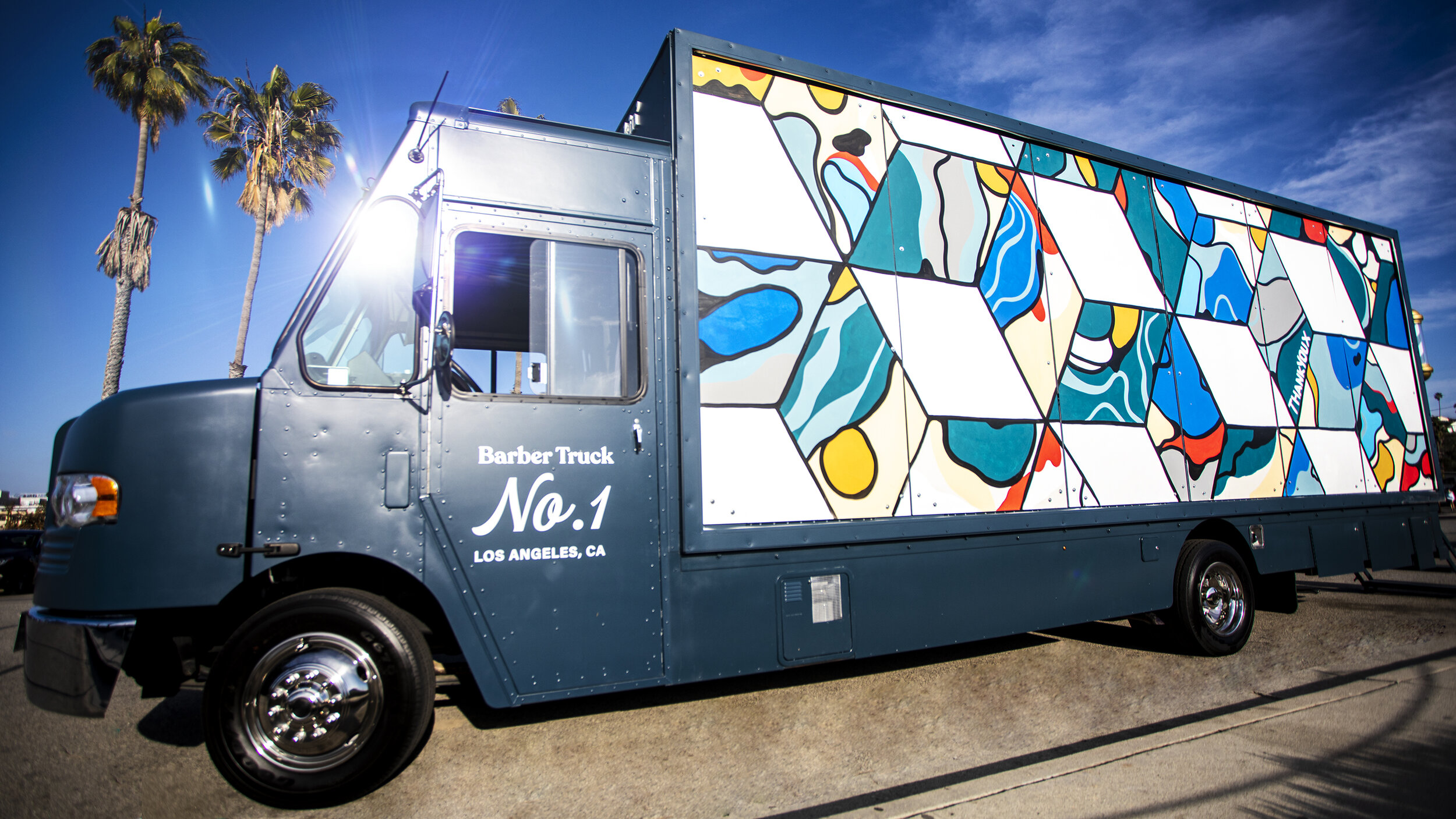 Barber Truck No. 1 exterior image of art wall with cubes mural by ThankYouX