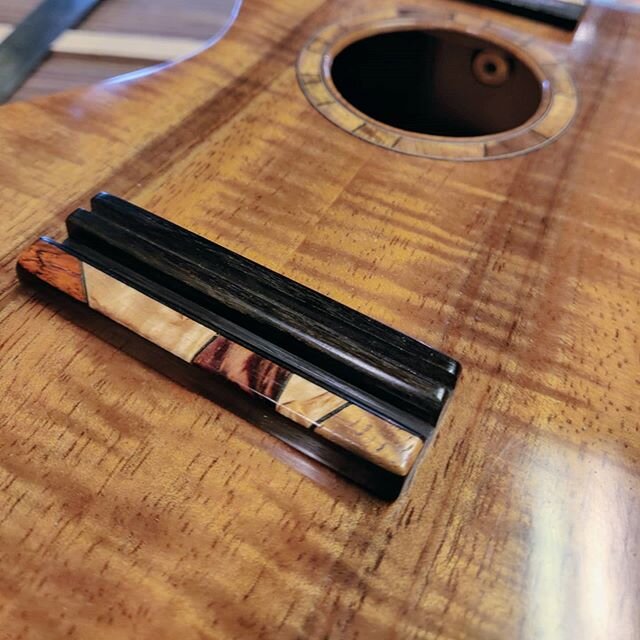 Came up with a nice idea for a ukulele bridge tie block 🙂
@helsinkitonefest #ukulele #mastergrade #concert  #koa  #acousticguitar #luthier #premiumguitars #woodmosaic #rosette  #timbretones #getyoursnow #madeinfinland #woodcraft #guitarmaking #handm