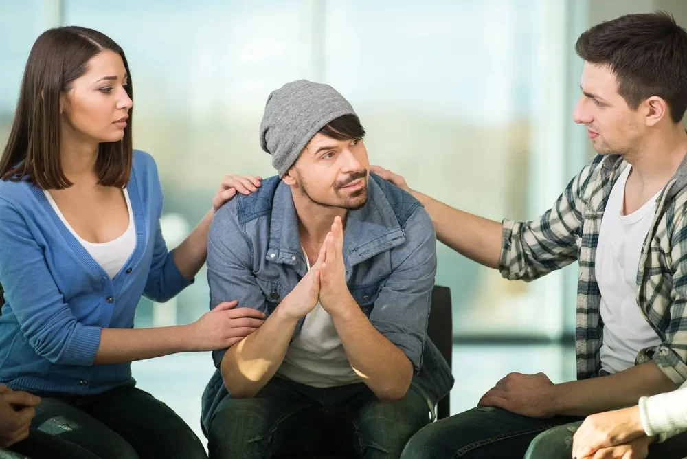 Three people during group therapy.