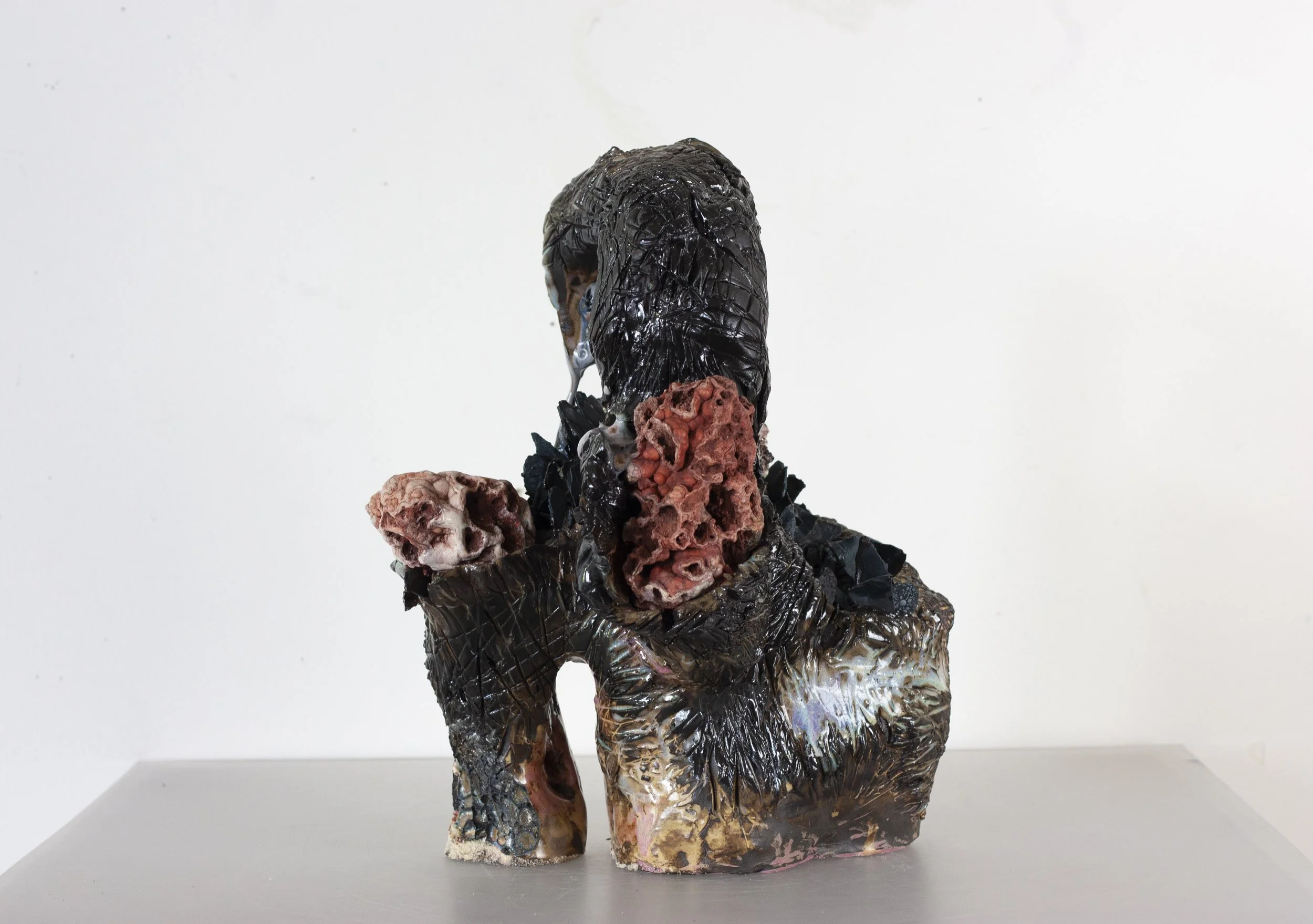 "Scorpion Mother," 2023. Serrated black stoneware, underglaze, crushed steel glaze, melted steel chips, Huzzah Valley found rocks, studio detritus, glaze.